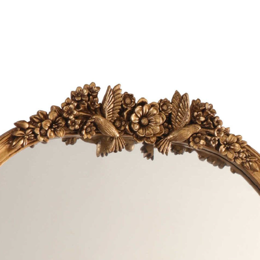 French gilt mirror featuring bird and botanical motifs