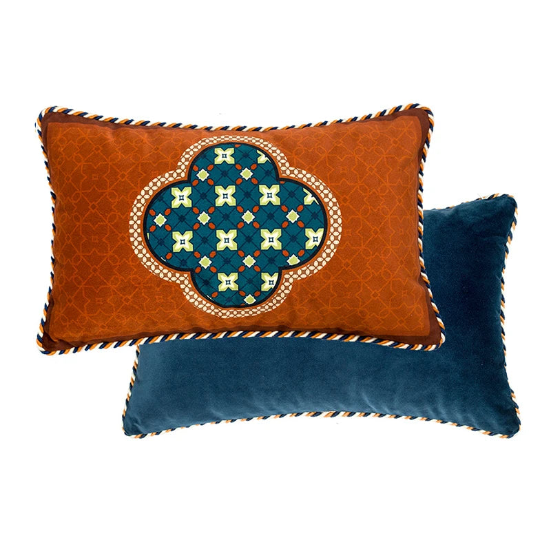 Decorative French-inspired velvet quatrefoil pillows on sofa